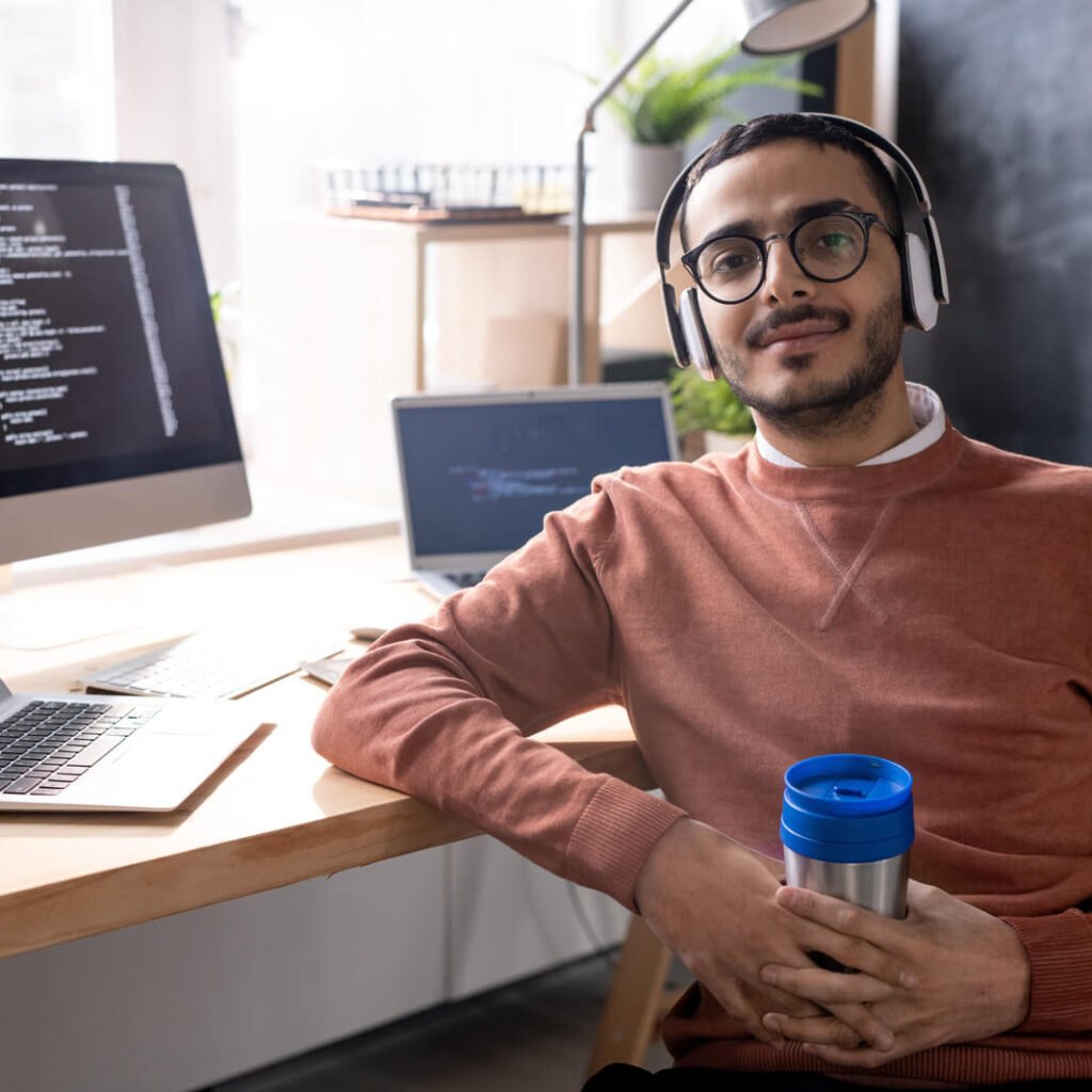 handsome programmer in headphones listening to mus 2023 11 27 04 56 48 utc.jpg